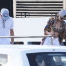 Leonardo DiCaprio, 48, gets close to his latest squeeze Victoria Lamas, 23, on a New Year's party yacht with pals Tobey Maguire and Drake in St. Barts
