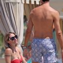 Michelle Hunziker – Seen in Red Bikini at Alpemare Beach in Forte Dei Marmi, Italy - 454 x 681