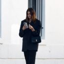 Kaia Gerber – Busy on her phone while leaving a studio in Los Angeles