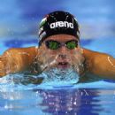 Daniel Gyurta of Hungary celebrates winning the final of the Men's 200m Breaststroke in a world record time of 2:00:48 during the FINA Swimming World Cup at Hamdan Sports Complex on August 31, 2014 in Dubai, United Arab Emirates - 454 x 567