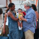 George Lucas and his wife Mellody Hobson stepped out for the first time with their new baby girl Everest on New Year's Day in St. Barts - 454 x 551