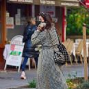 Jenna Coleman &#8211; In a monochrome coat on her phone while out in Marylebon