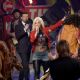 Host Ryan Seacrest, finalist Jax, and singer/songwriter Steven Tyler speak onstage during 