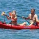Jennette McCurdy wearing a pretty bikini and board shorts was spotted kayaking with a male friend in Maui