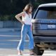 Milla Jovovich – Pumping gas into her $145k Range Rover Autobiography on Sunset Blvd