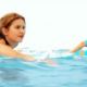 Amber (Philippa Coulthard) and Kiki (Jessica Green) surfing