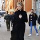 Robin Wright – In a black trench coat and knee long boots in New York