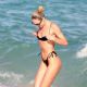 Candice Swanepoel – In a black bikini at the beach in Miami
