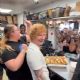 Ed Sheeran gave some lucky fans the surprise of a lifetime after stepping behind the counter of an iconic hotdog stand on the north side of Chicago