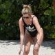 Rhea Durham in Black Adidas Swimsuit at the beach in Barbados
