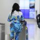 Vivica A. Fox – In a tie-died tracksuit for her arrival at LAX in Los Angeles