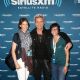 Musician Billy Idol  poses with fans backstage before performing for SiriusXM's Artist Confidential Series at The Troubadour on October 22, 2014 in Los Angeles, California