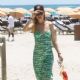 Behati Prinsloo -In a green dress in Miami Beach
