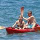 Jennette McCurdy wearing a pretty bikini and board shorts was spotted kayaking with a male friend in Maui