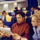 Reading about Lizzie’s misadventures, her mom (Hallie Todd, right), dad (Robert Carradine, center) and annoying brother Matt (Jake Thomas, left) all fly off to Italy