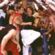 Pals Brandon (Greg Siff, in red shirt), Justin (Justin Guarini), and Eddie (Brian Dietzen, in hat) enjoy Spring Break with new friends played by, left to right, Leo Moctezuma, Christian George, Travis Payne, and, kneeling, Brandon Henschel and Kato Bonner