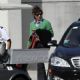Mick Jagger and L'Wren Scott boards a plane at airport in Miami - 9 March 2009