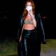 Bella Thorne – In a trench coat arriving to her manager’s birthday bash in Hollywood