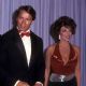 Arnold Schwarzenegger and Joan Collins attends The 56th Annual Academy Awards
