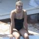 Selena Gomez – In black swimsuit on a boat in Positano