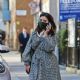 Jenna Coleman – In a monochrome coat on her phone while out in Marylebon