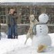 Marley makes important contributions to the building of a snowman, as John (Owen Wilson) and Jenny (Jennifer Aniston) look on. Photo credit: Barry Wetcher. © 2008 Twentieth Century Fox and Regency Enterprises. All rights reserved.