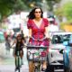 Famke Janssen – Wears colorful dress while out for a bike ride in New York