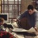 Adam Sandler puts some newspaper down to stop the bedwetting problem in Big Daddy