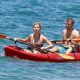 Jennette McCurdy wearing a pretty bikini and board shorts was spotted kayaking with a male friend in Maui