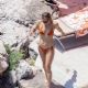 Kate Hudson – In an orange bikini in Positano